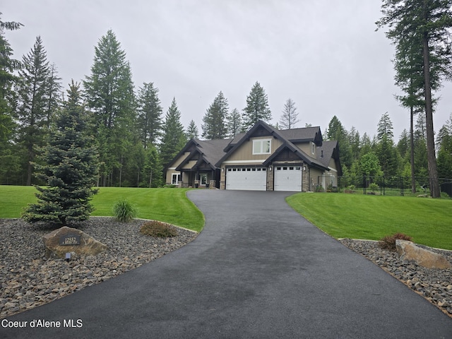 12552 N Walden Loop, Rathdrum, ID 83858 - craftsman house with driveway, stone siding, a garage, and board and batten siding