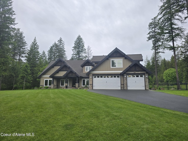 12552 N Walden Loop, Rathdrum, ID 83858 - craftsman-style house featuring stone siding, driveway, and an attached garage