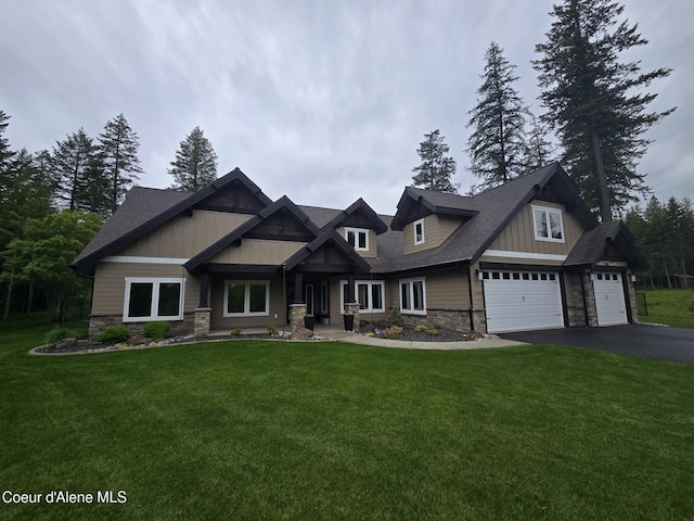 12552 N Walden Loop, Rathdrum, ID 83858 - craftsman inspired home featuring stone siding, asphalt driveway, a front yard, and roof with shingles