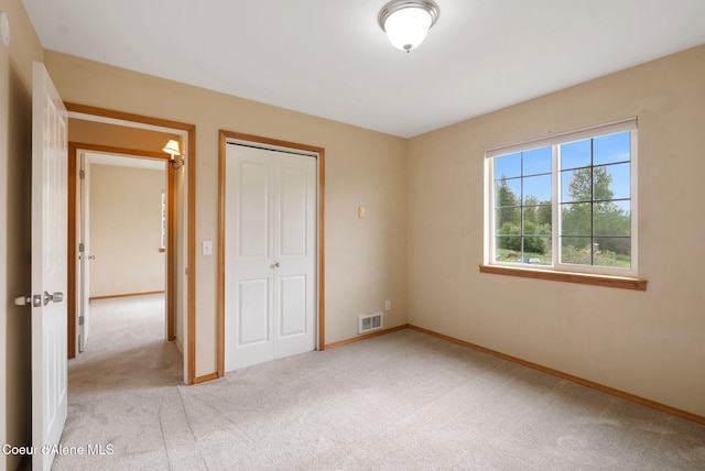 410 Humbird St, Kootenai, ID 83840 - unfurnished bedroom with light colored carpet, a closet, and baseboards