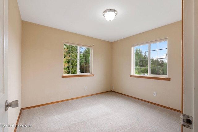 410 Humbird St, Kootenai, ID 83840 - spare room featuring healthy amount of natural light, light carpet, and baseboards