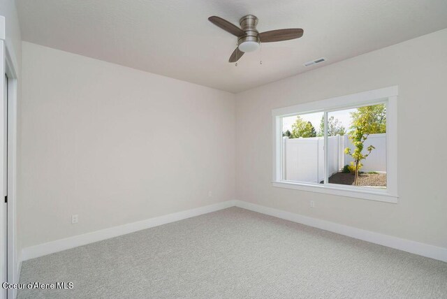 7291 N Grafton St, Coeur Dalene, ID 83815 - empty room with baseboards, carpet floors, and ceiling fan