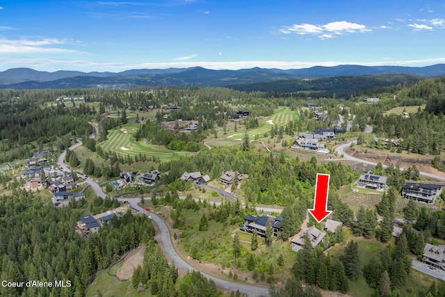 7783 S Buckrail Rd, Harrison, ID 83833 - aerial view of property and surrounding area with a mountainous background, a forest, and nearby suburban area