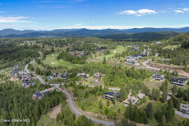 7783 S Buckrail Rd, Harrison, ID 83833 - view of property location featuring a mountain backdrop, a forest, and nearby suburban area
