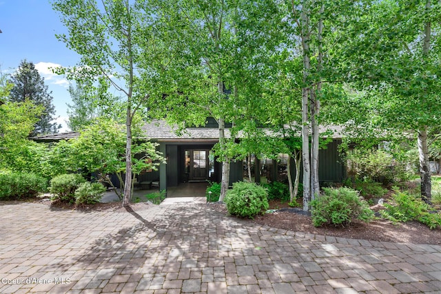 7783 S Buckrail Rd, Harrison, ID 83833 - view of property hidden behind natural elements with a tile roof