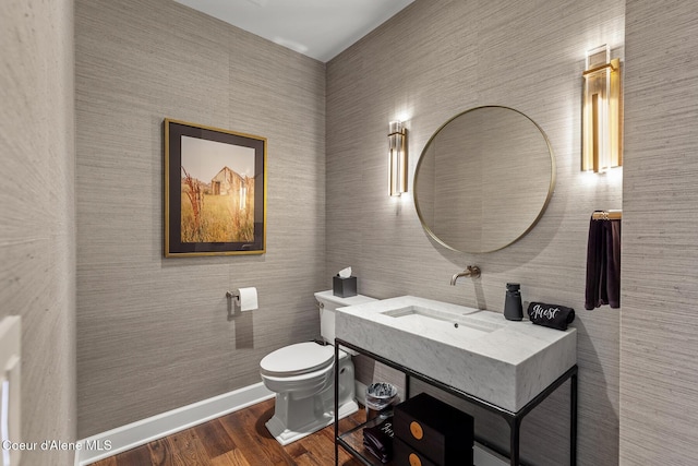 7783 S Buckrail Rd, Harrison, ID 83833 - bathroom with toilet, vanity, wood finished floors, and baseboards