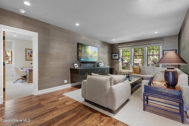 7783 S Buckrail Rd, Harrison, ID 83833 - living room featuring wallpapered walls, wood finished floors, baseboards, and recessed lighting