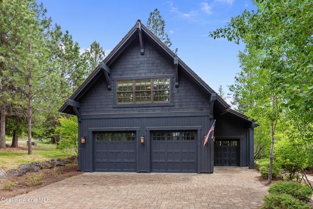 7783 S Buckrail Rd, Harrison, ID 83833 - view of front facade featuring a garage and decorative driveway