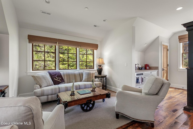 7783 S Buckrail Rd, Harrison, ID 83833 - living area with vaulted ceiling, baseboards, wood finished floors, and recessed lighting