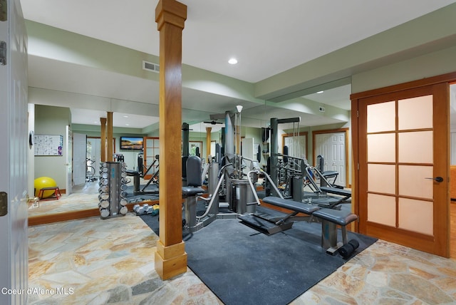 2672 Merril Martin Rd, Sagle, ID 83860 - exercise room with ornate columns and stone finish floors