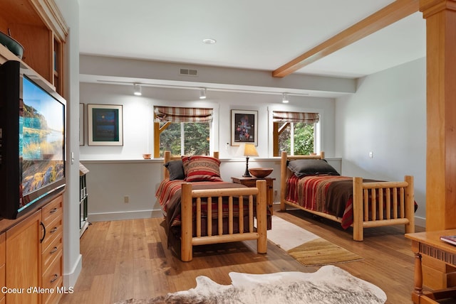 2672 Merril Martin Rd, Sagle, ID 83860 - bedroom featuring rail lighting, light wood finished floors, and multiple windows