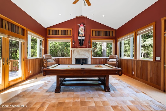 2672 Merril Martin Rd, Sagle, ID 83860 - rec room with vaulted ceiling, billiards table, a ceiling fan, a high end fireplace, and wood walls