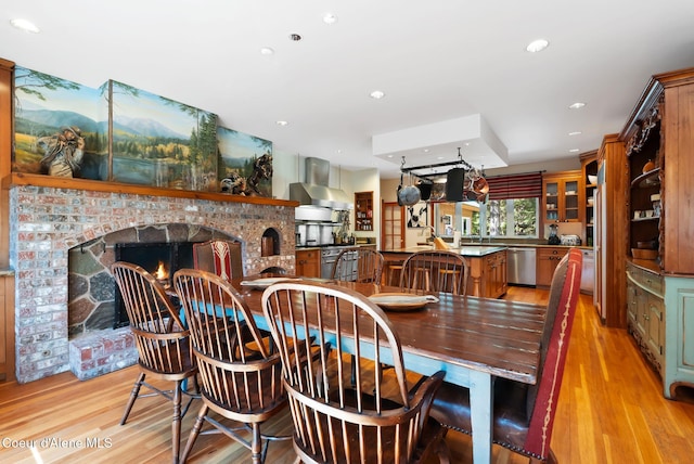 2672 Merril Martin Rd, Sagle, ID 83860 - dining area with light wood finished floors, a fireplace, and recessed lighting