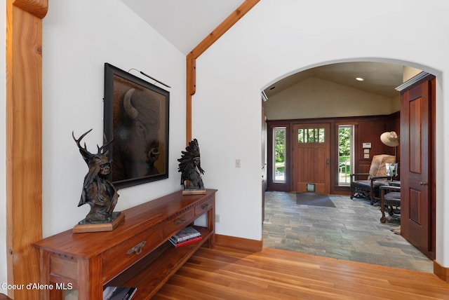 2672 Merril Martin Rd, Sagle, ID 83860 - foyer featuring vaulted ceiling, arched walkways, wood finished floors, and recessed lighting