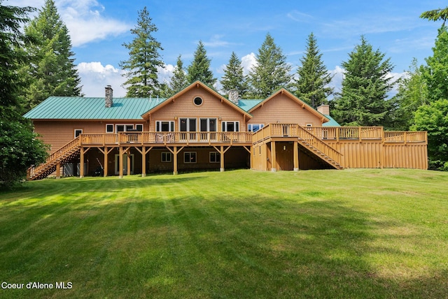 2672 Merril Martin Rd, Sagle, ID 83860 - back of property with stairs, a deck, a chimney, and a lawn