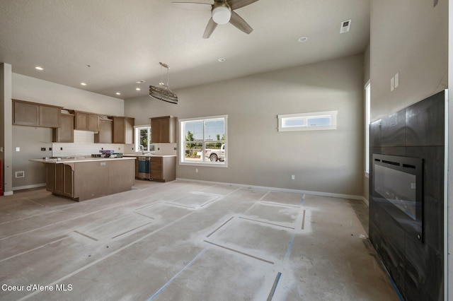 7388 N Breaux Dr, Coeur Dalene, ID 83815 - kitchen with a center island, ceiling fan, stainless steel dishwasher, baseboards, and recessed lighting
