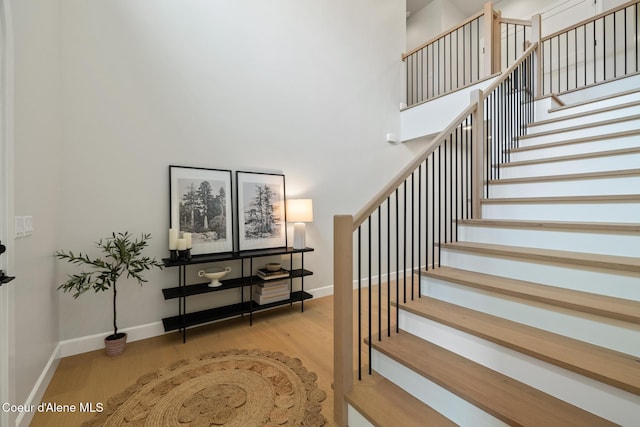 11947 N Rocking R Rd, Hayden, ID 83835 - stairs featuring wood finished floors, baseboards, and a towering ceiling