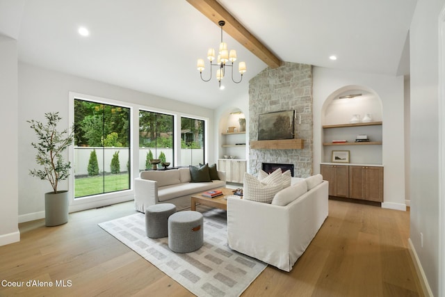 11947 N Rocking R Rd, Hayden, ID 83835 - living room featuring a stone fireplace, baseboards, light wood-style floors, and built in features
