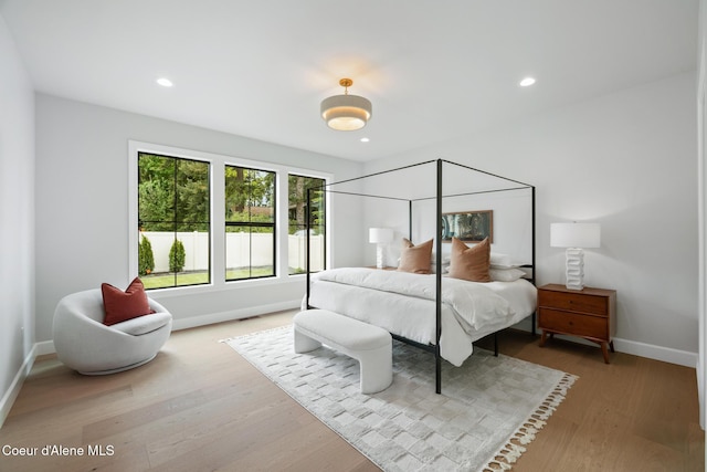 11947 N Rocking R Rd, Hayden, ID 83835 - bedroom featuring baseboards, wood finished floors, and recessed lighting