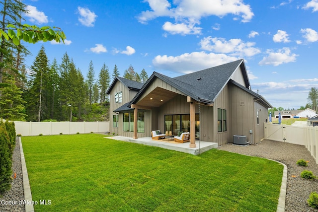 11947 N Rocking R Rd, Hayden, ID 83835 - rear view of property with roof with shingles, a gate, board and batten siding, a patio, and cooling unit