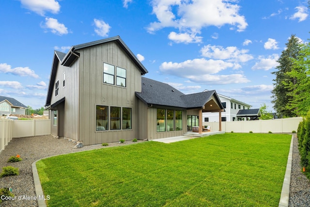 11947 N Rocking R Rd, Hayden, ID 83835 - rear view of house featuring a patio area, board and batten siding, and a shingled roof