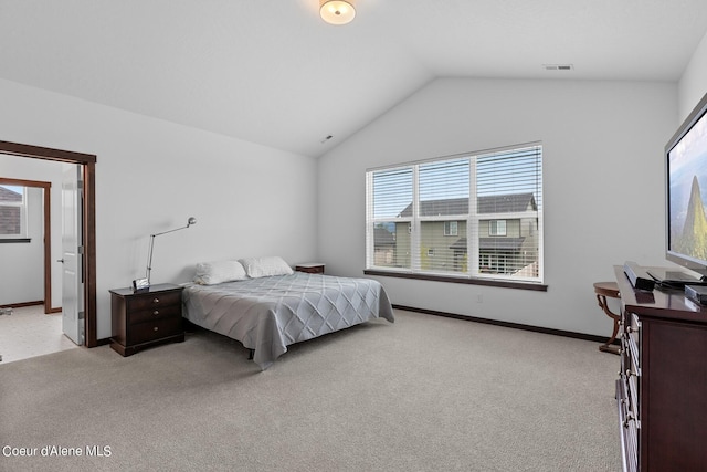 4463 E Marble Fox Ave, Post Falls, ID 83854 - bedroom with lofted ceiling, light carpet, and baseboards