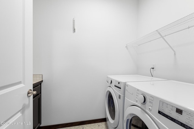 4463 E Marble Fox Ave, Post Falls, ID 83854 - laundry room featuring washing machine and dryer and cabinet space