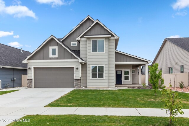 4463 E Marble Fox Ave, Post Falls, ID 83854 - craftsman inspired home featuring board and batten siding, concrete driveway, a garage, and stone siding