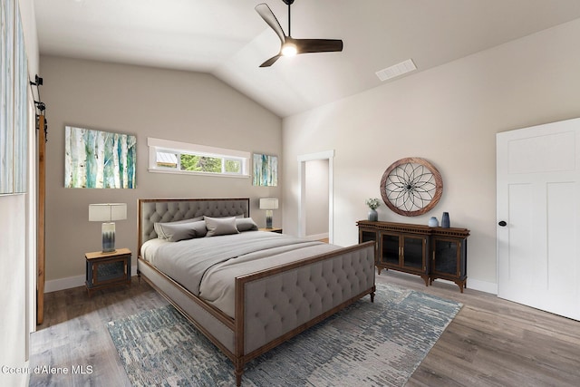 193 Grouse Rd, Sandpoint, ID 83864 - bedroom with wood finished floors, lofted ceiling, baseboards, and a ceiling fan