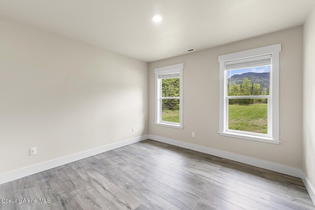 193 Grouse Rd, Sandpoint, ID 83864 - empty room featuring wood finished floors, baseboards, and recessed lighting