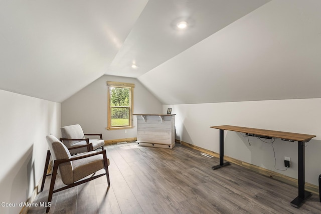 193 Grouse Rd, Sandpoint, ID 83864 - living area featuring vaulted ceiling, wood finished floors, and baseboards