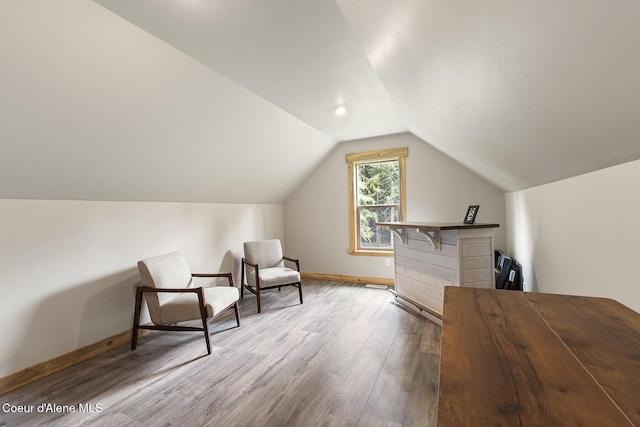 193 Grouse Rd, Sandpoint, ID 83864 - living area featuring wood finished floors, baseboards, and lofted ceiling