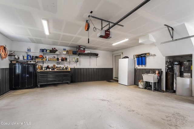 193 Grouse Rd, Sandpoint, ID 83864 - garage featuring a garage door opener and a sink