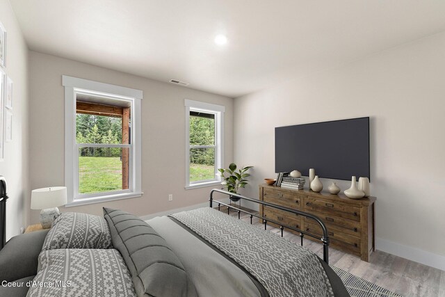 193 Grouse Rd, Sandpoint, ID 83864 - bedroom with baseboards and wood finished floors