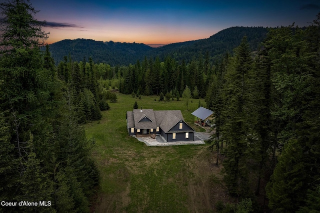 193 Grouse Rd, Sandpoint, ID 83864 - aerial view at dusk of a mountain view and a wooded view