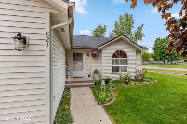 821 W Mustang Ave, Hayden, ID 83835 - doorway to property featuring a yard and a shingled roof