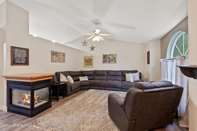 821 W Mustang Ave, Hayden, ID 83835 - living area with wood finished floors, a ceiling fan, and vaulted ceiling