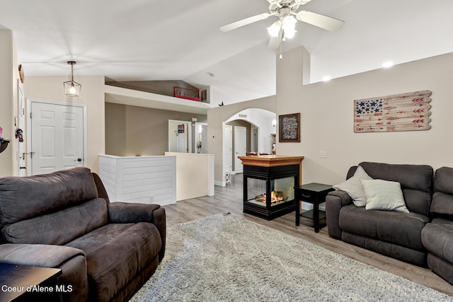 821 W Mustang Ave, Hayden, ID 83835 - living area with vaulted ceiling, ceiling fan, wood finished floors, and arched walkways