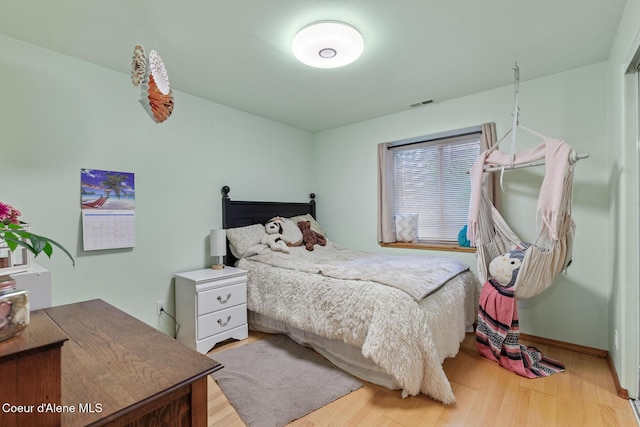 821 W Mustang Ave, Hayden, ID 83835 - bedroom featuring light wood-style floors and baseboards