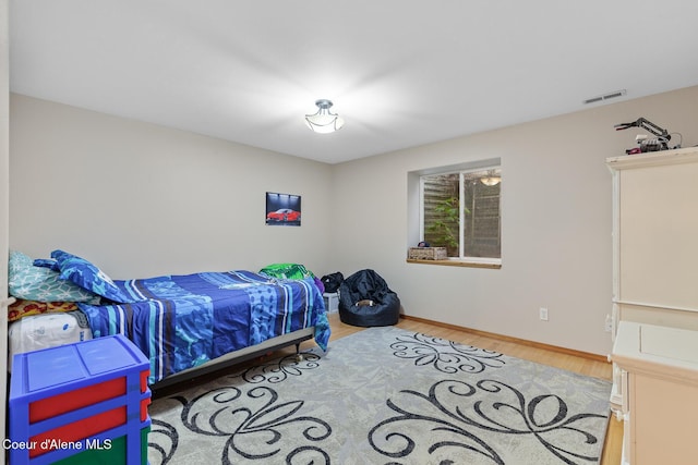 821 W Mustang Ave, Hayden, ID 83835 - bedroom with wood finished floors and baseboards