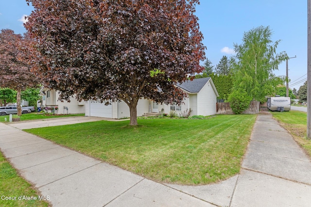 821 W Mustang Ave, Hayden, ID 83835 - view of front of home featuring concrete driveway and a garage