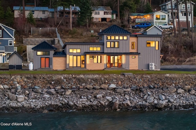 1808 Garfield Bay Rd, Sagle, ID 83860 - rear view of property featuring a standing seam roof, board and batten siding, metal roof, and a water view