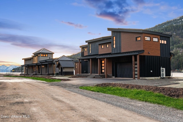 1808 Garfield Bay Rd, Sagle, ID 83860 - view of front of property with driveway, a garage, metal roof, a standing seam roof, and board and batten siding