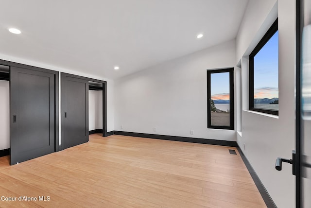 1808 Garfield Bay Rd, Sagle, ID 83860 - unfurnished bedroom featuring light wood-style flooring, recessed lighting, and baseboards