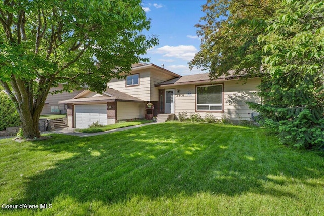 2101 W Bordeaux Ave, Hayden, ID 83835 - split level home featuring a front yard, a garage, and brick siding