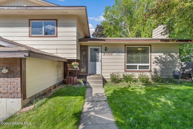 2101 W Bordeaux Ave, Hayden, ID 83835 - view of front of property featuring a front yard and a chimney