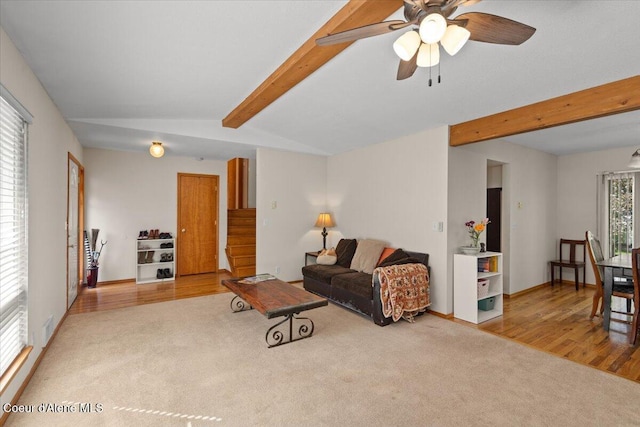 2101 W Bordeaux Ave, Hayden, ID 83835 - carpeted living room with a ceiling fan, wood finished floors, and baseboards