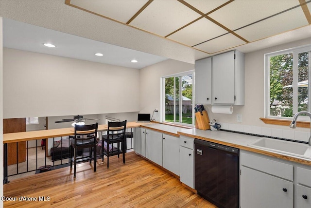 2101 W Bordeaux Ave, Hayden, ID 83835 - kitchen featuring dishwasher, a sink, healthy amount of natural light, light wood-style floors, and recessed lighting