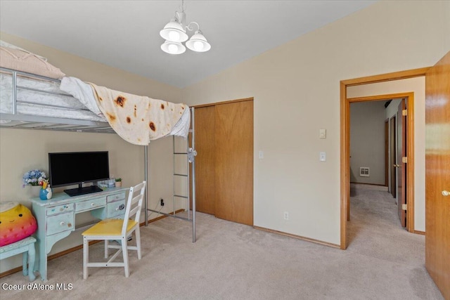2101 W Bordeaux Ave, Hayden, ID 83835 - bedroom featuring a chandelier, carpet floors, a closet, and baseboards