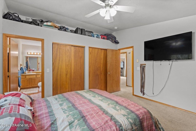 2101 W Bordeaux Ave, Hayden, ID 83835 - bedroom featuring light carpet, two closets, lofted ceiling, connected bathroom, and a ceiling fan